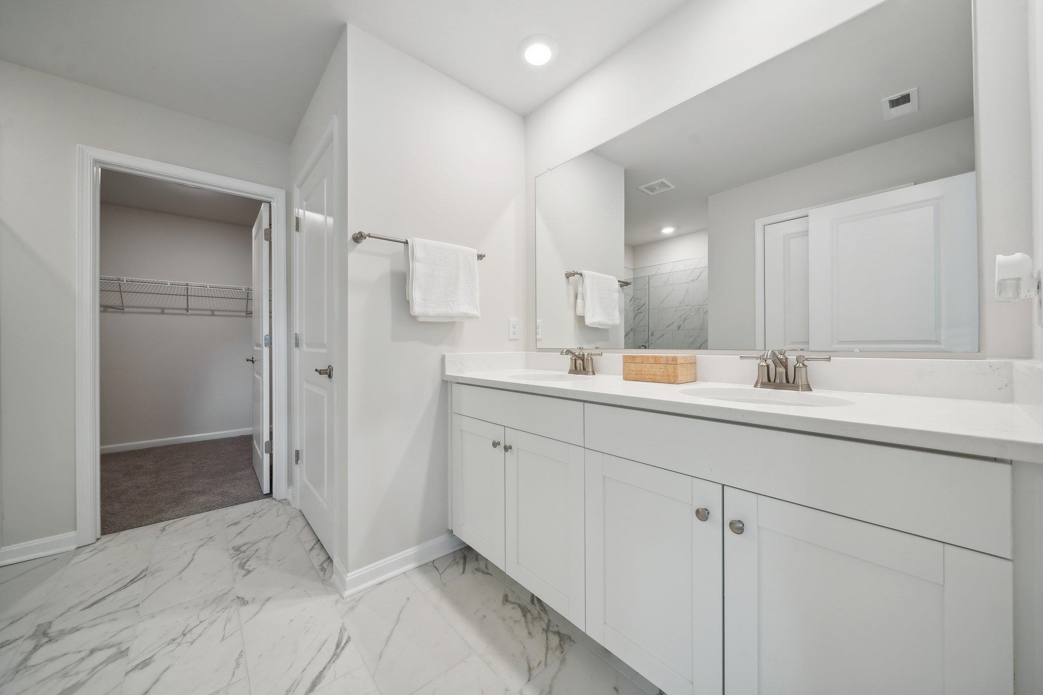172 Liberty Lane Keswick, VA 22947 - Photo 13 of 21 a bathroom with a double vanity sink mirror and shower