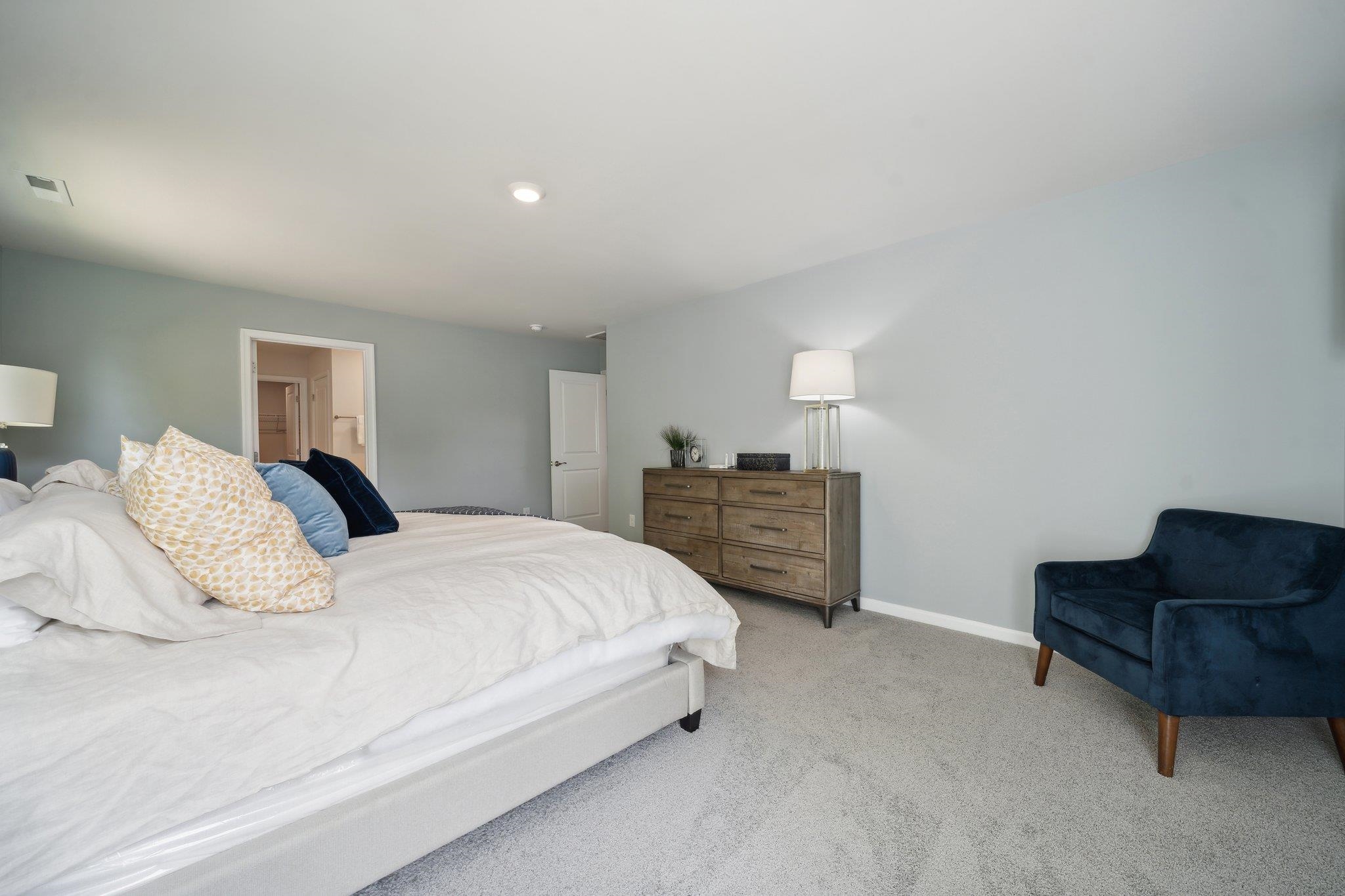 172 Liberty Lane Keswick, VA 22947 - Photo 21 of 21 a bedroom with a bed and dresser