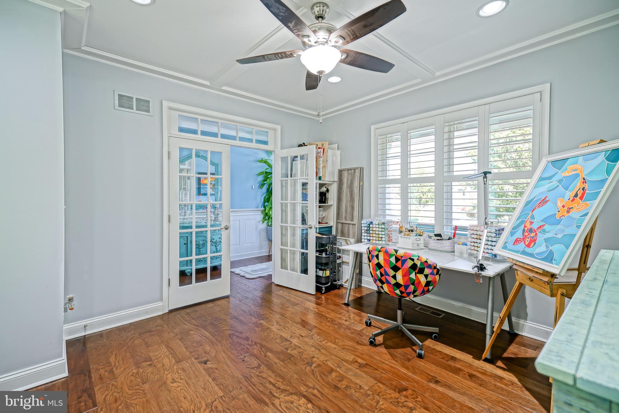 35236 Acadia Lane Lewes, DE 19958 - Photo 13 of 88 a living room with furniture and flat screen tv