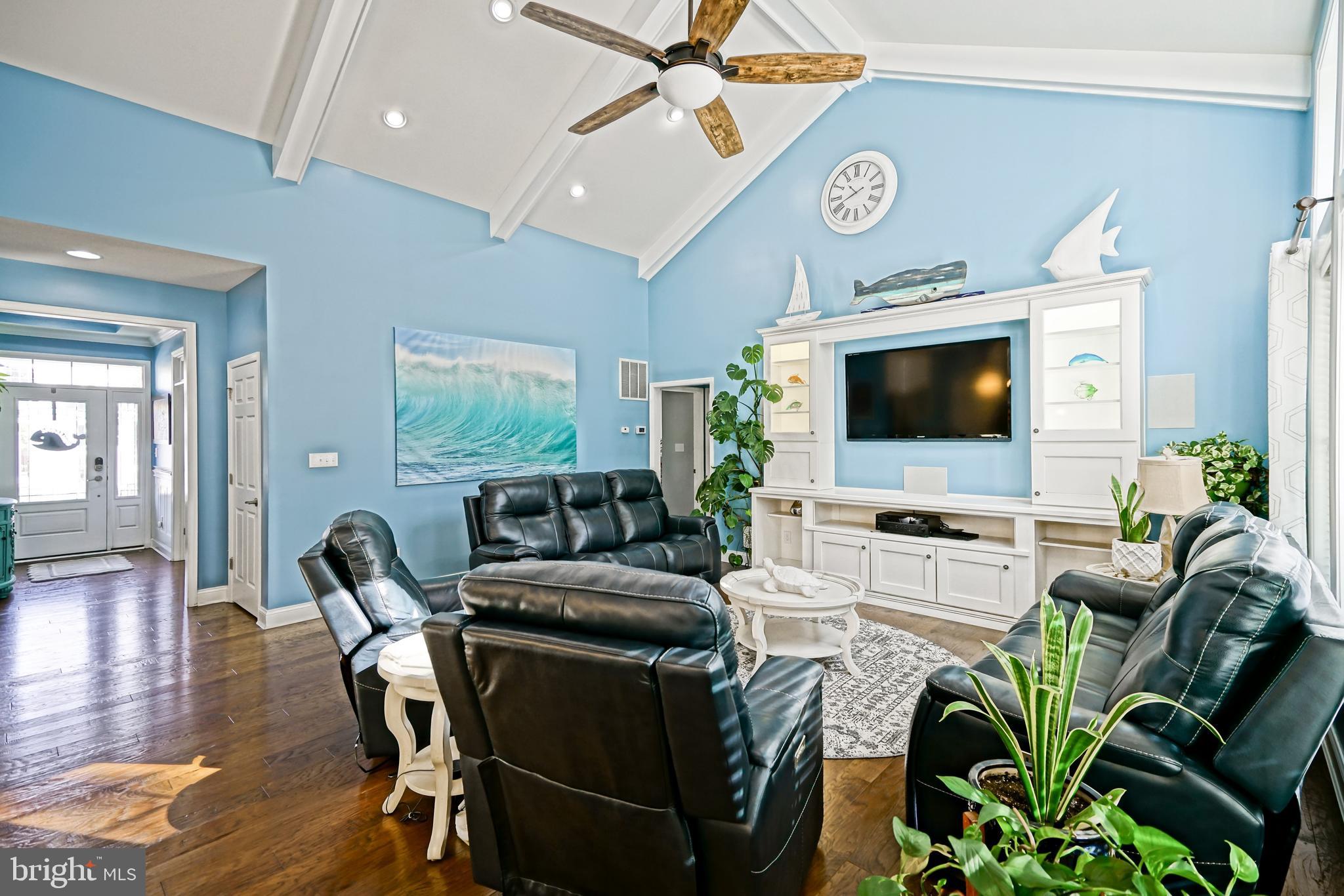 35236 Acadia Lane Lewes, DE 19958 - Photo 29 of 88 a living room with furniture and a flat screen tv