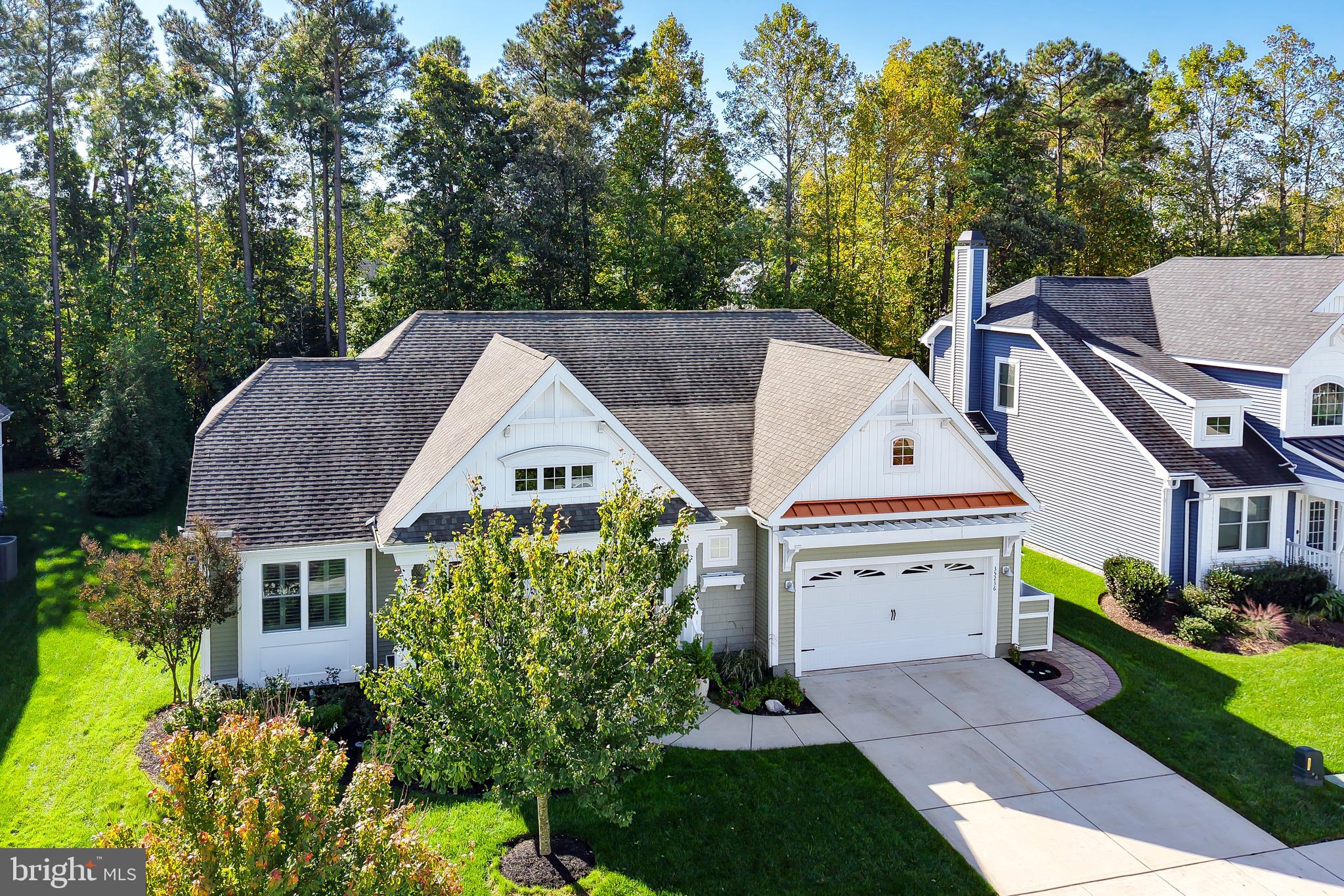 35236 Acadia Lane Lewes, DE 19958 - Photo 3 of 88 a aerial view of a house with a yard and potted plants