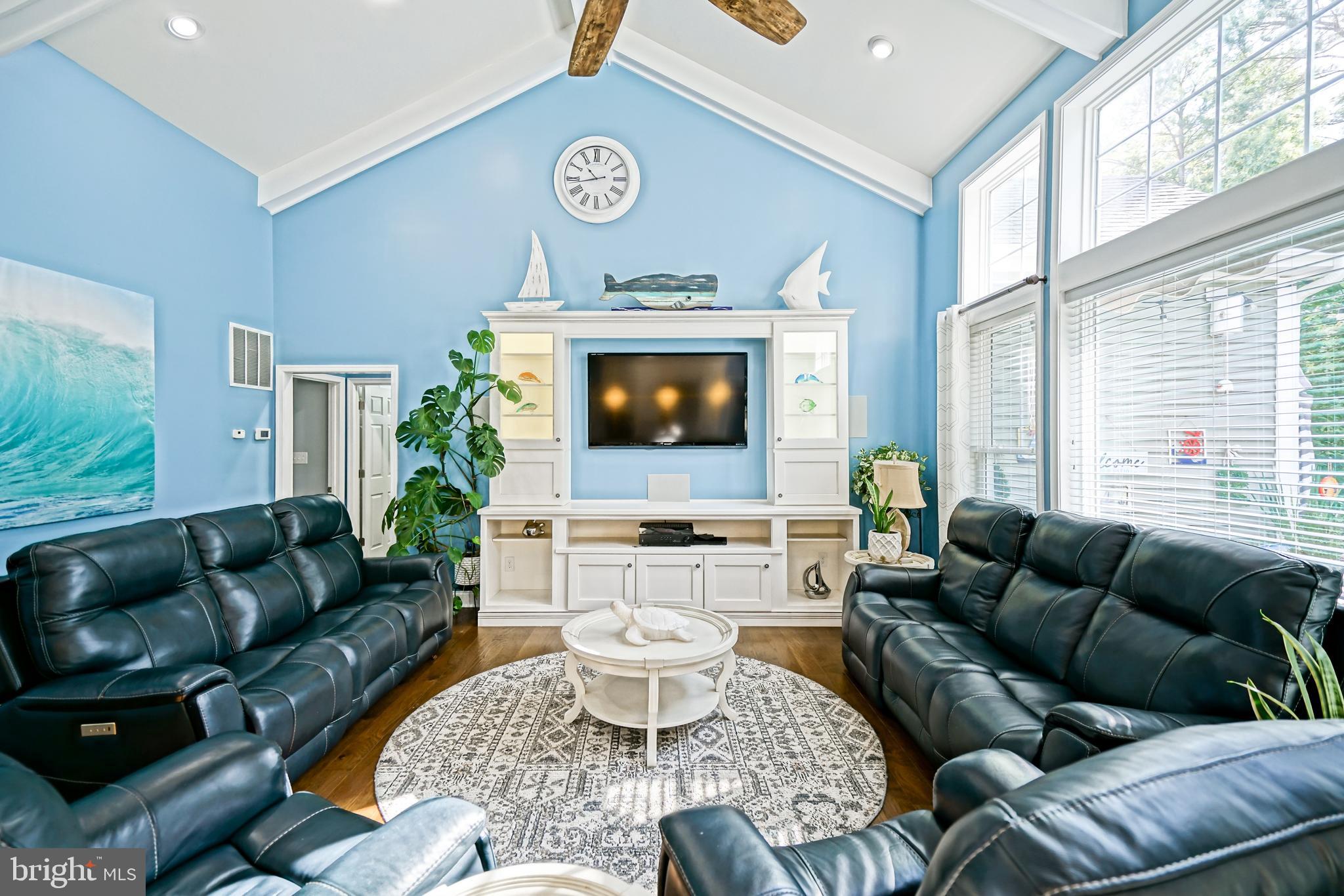 35236 Acadia Lane Lewes, DE 19958 - Photo 34 of 88 a living room with furniture and a flat screen tv