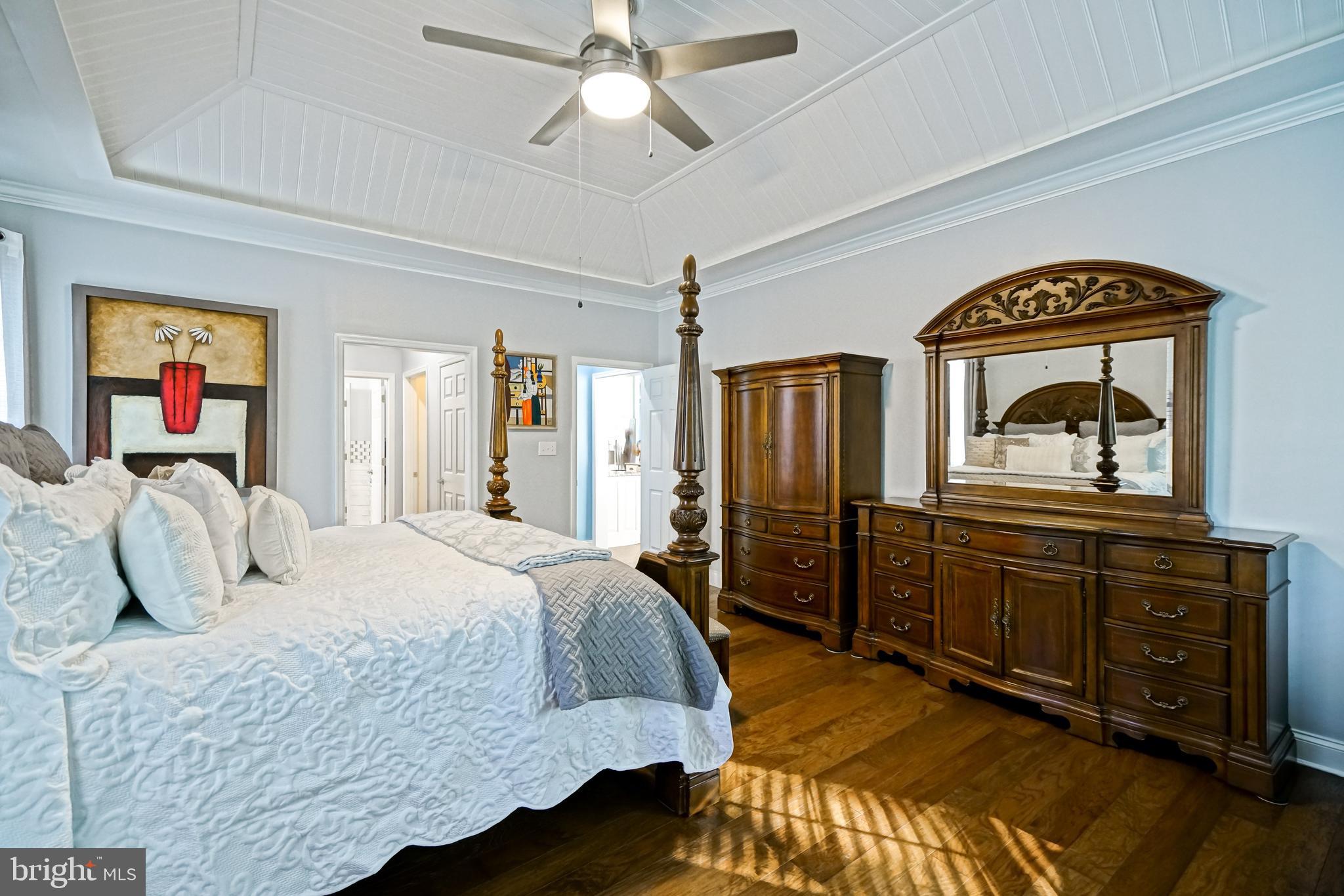 35236 Acadia Lane Lewes, DE 19958 - Photo 38 of 88 a bedroom with a bed and a dresser