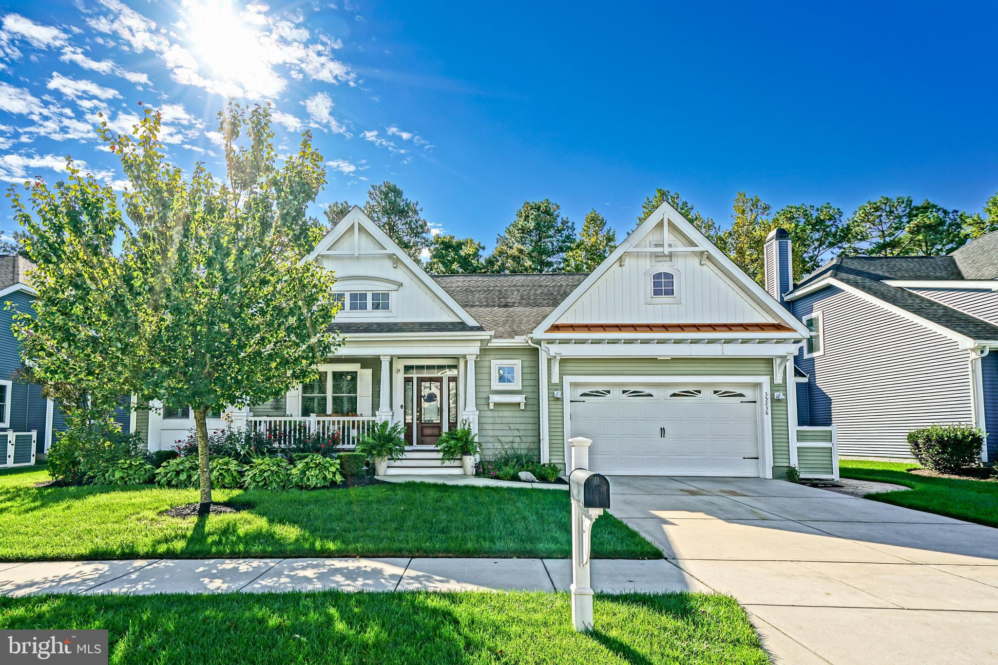 35236 Acadia Lane Lewes, DE 19958 - Photo 4 of 88 a front view of a house with a yard and garage