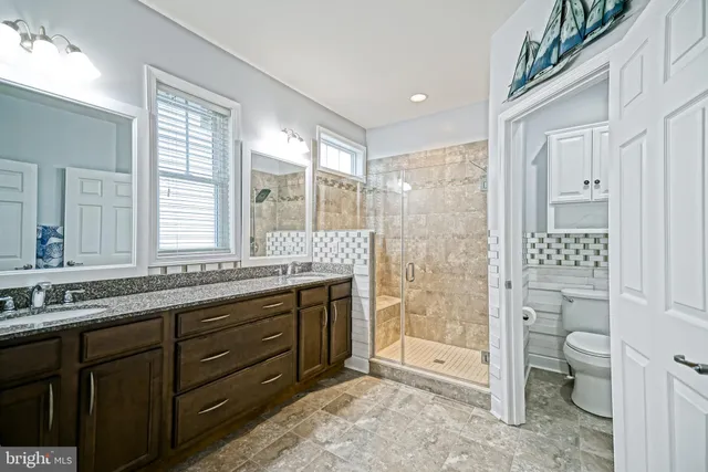 a view of a patio with couches chairs and a potted plant