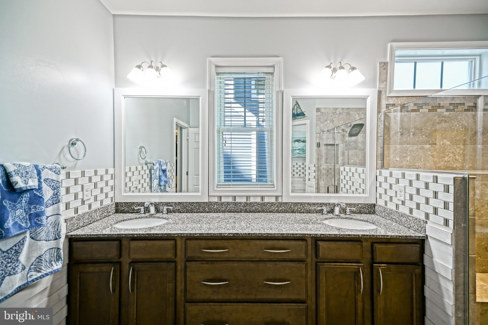 35236 Acadia Lane Lewes, DE 19958 - Photo 42 of 88 a bathroom with a sink and a mirror