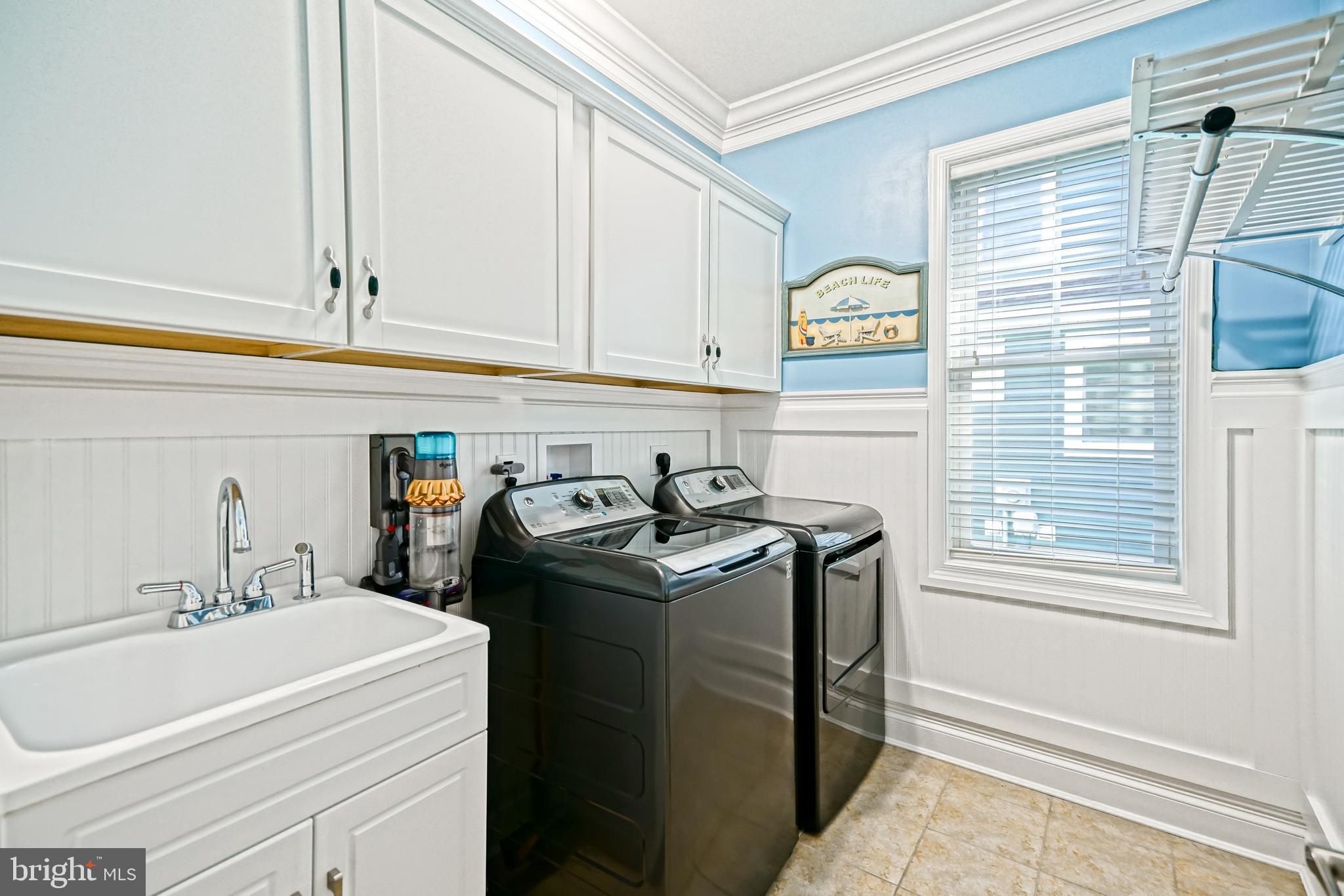 35236 Acadia Lane Lewes, DE 19958 - Photo 50 of 88 a utility room with stainless steel appliances granite countertop a sink and a window