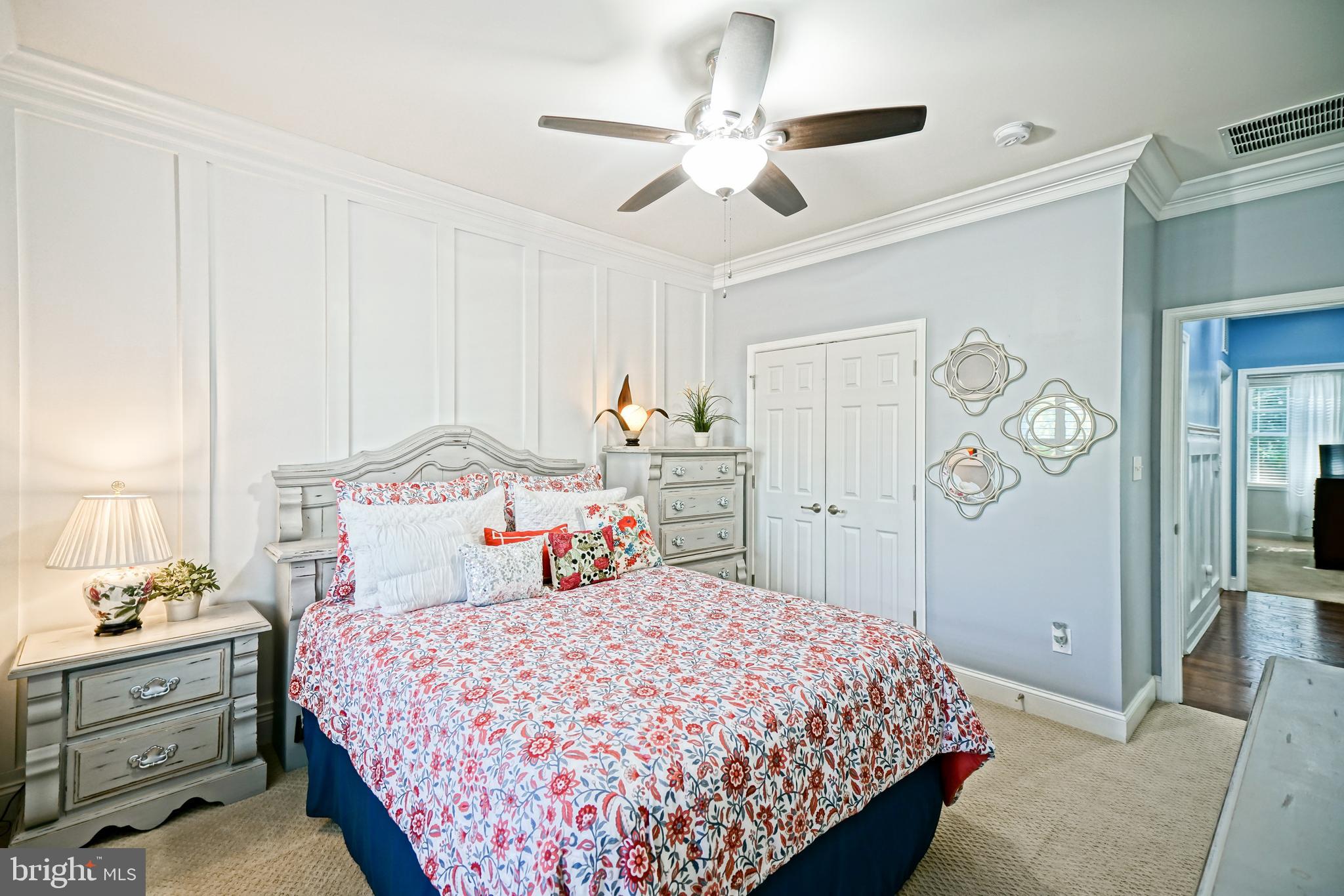 35236 Acadia Lane Lewes, DE 19958 - Photo 53 of 88 a bedroom with a bed and a chandelier