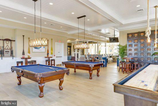 35236 Acadia Lane Lewes, DE 19958 - Photo 84 of 88 a living room with furniture a table and a chandelier