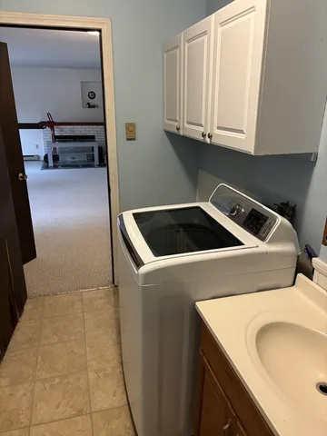 a bathroom with a sink and mirror