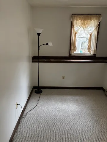 a kitchen with a refrigerator and window