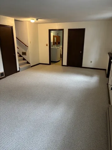 a view of staircase with a rug