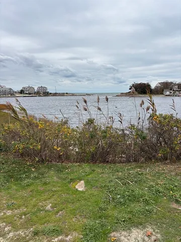 a view of a street with an ocean view