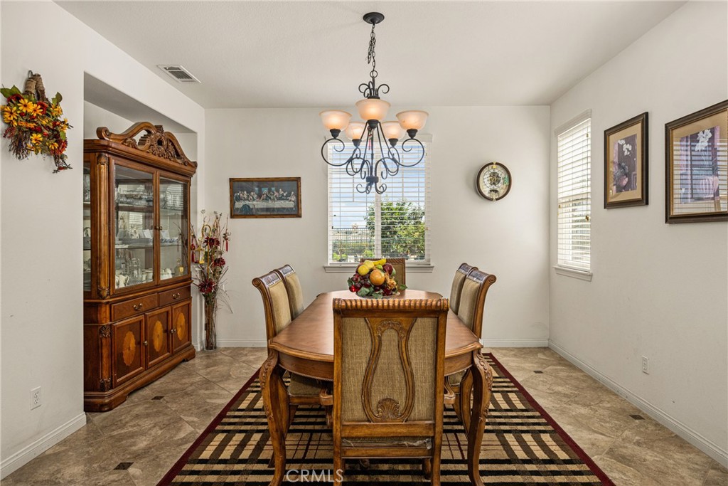 12652 Twin Peak Court Riverside, CA 92503 - Photo 18 of 55 a view of a dining room with furniture window and wooden floor