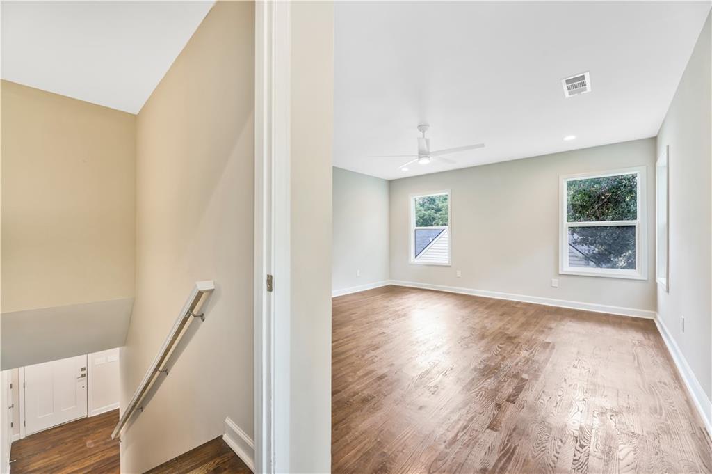 1776 Temple Avenue Atlanta, GA 30337 - Photo 11 of 18 a view of an empty room with wooden floor and a window