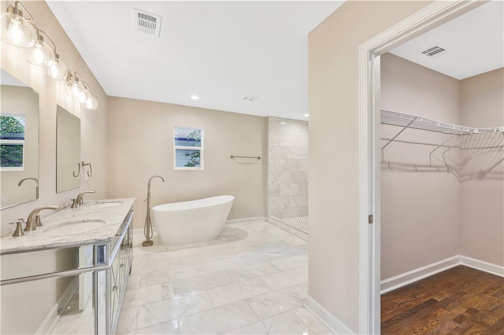 1776 Temple Avenue Atlanta, GA 30337 - Photo 14 of 18 a bathroom with a sink and a mirror