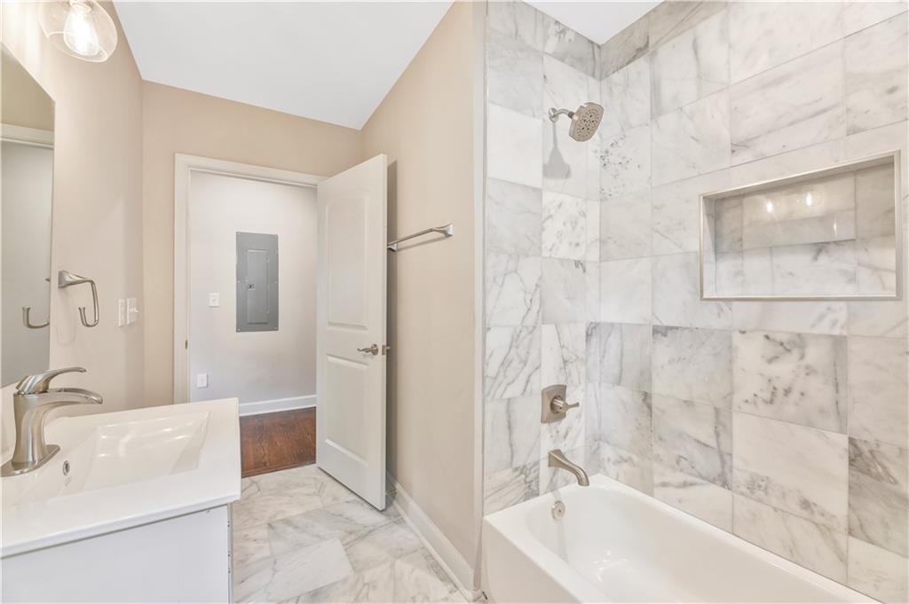 1776 Temple Avenue Atlanta, GA 30337 - Photo 8 of 18 a bathroom with a sink mirror toilet and bathtub