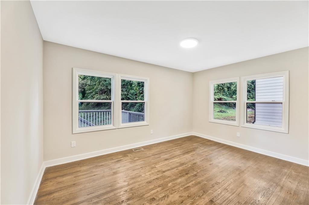 1776 Temple Avenue Atlanta, GA 30337 - Photo 10 of 18 an empty room with a window