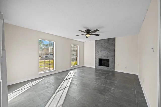 a view of an empty room with staircase