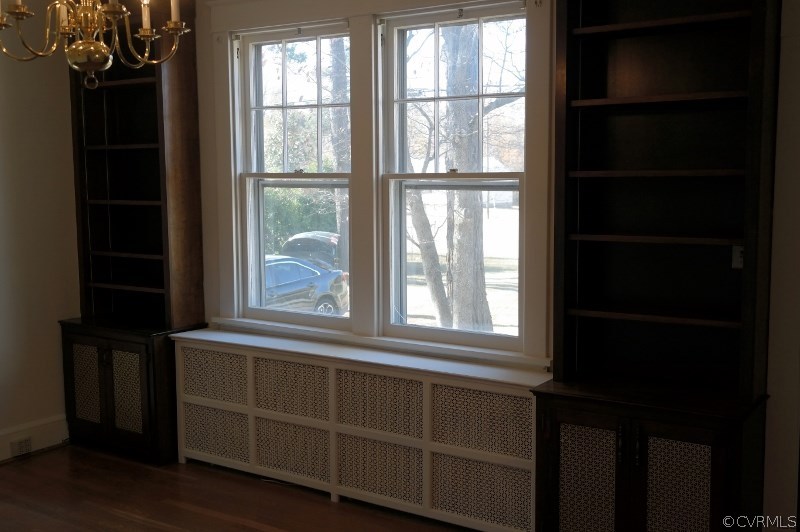6529 Hopkins Road North Chesterfield, VA 23234 - Photo 4 of 24 an empty room with wooden floor and windows