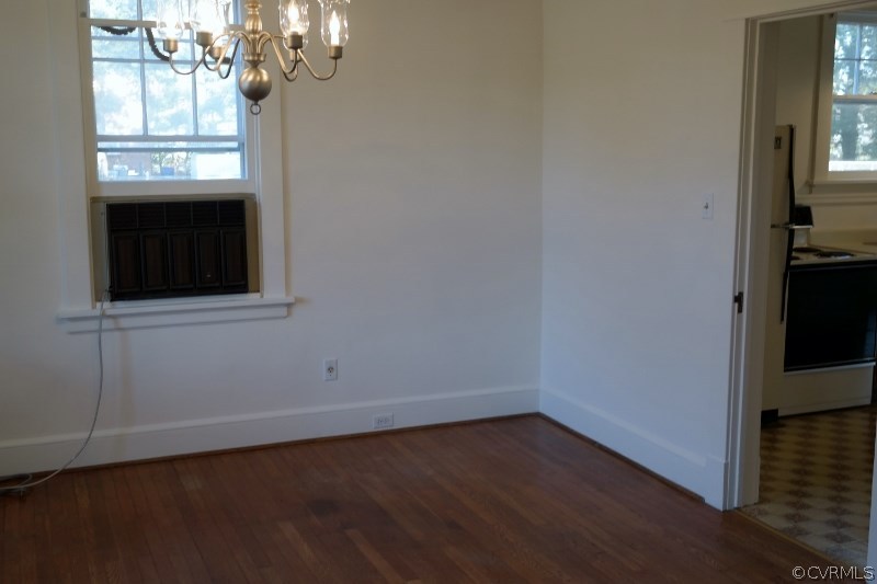 6529 Hopkins Road North Chesterfield, VA 23234 - Photo 5 of 24 wooden floor in an empty room with a window