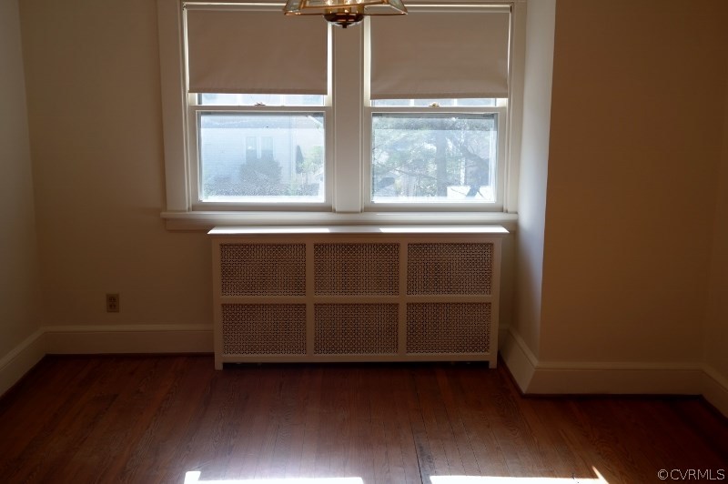 6529 Hopkins Road North Chesterfield, VA 23234 - Photo 9 of 24 an empty room with wooden floor and windows