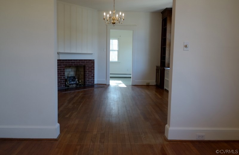 6529 Hopkins Road North Chesterfield, VA 23234 - Photo 10 of 24 a view of a livingroom with wooden floor and a fireplace