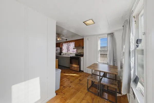 a view of kitchen and dining room with windows