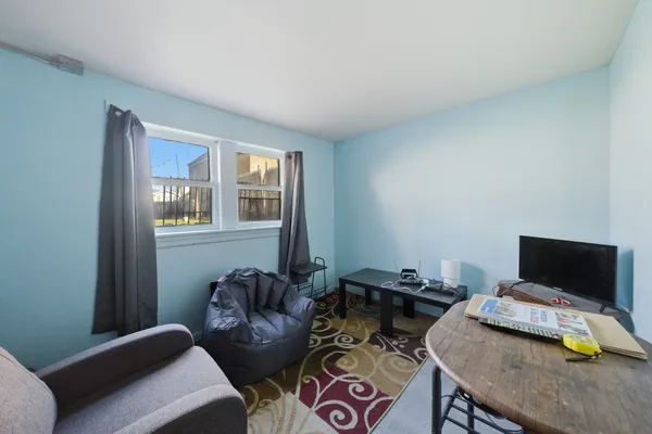 a bedroom with furniture and a window