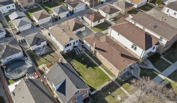 an aerial view of a house with a garden
