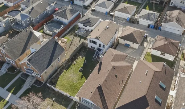 an aerial view of a house with a yard
