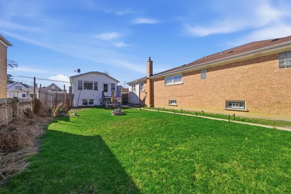 a view of a big house with a big yard