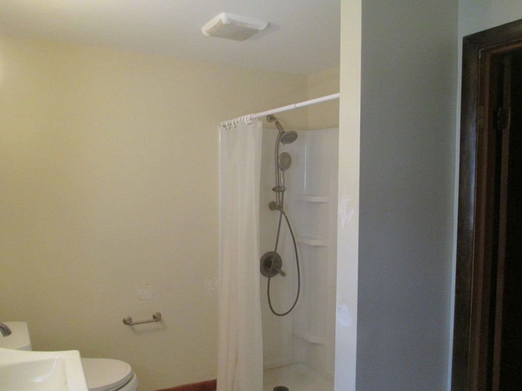 2 Barton Street Granby, MA 01033 - Photo 13 of 24 a bathroom with a shower and toilet
