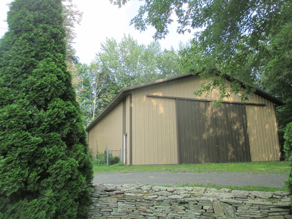 2 Barton Street Granby, MA 01033 - Photo 19 of 24 a backyard of a house with lots of green space
