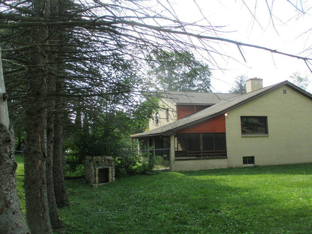 2 Barton Street Granby, MA 01033 - Photo 4 of 24 a front view of house with yard and outdoor seating
