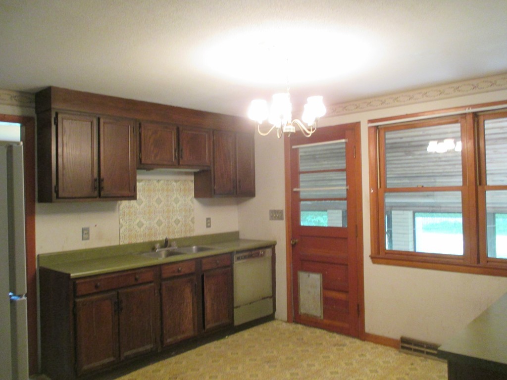 2 Barton Street Granby, MA 01033 - Photo 10 of 24 a kitchen with a sink cabinets and window