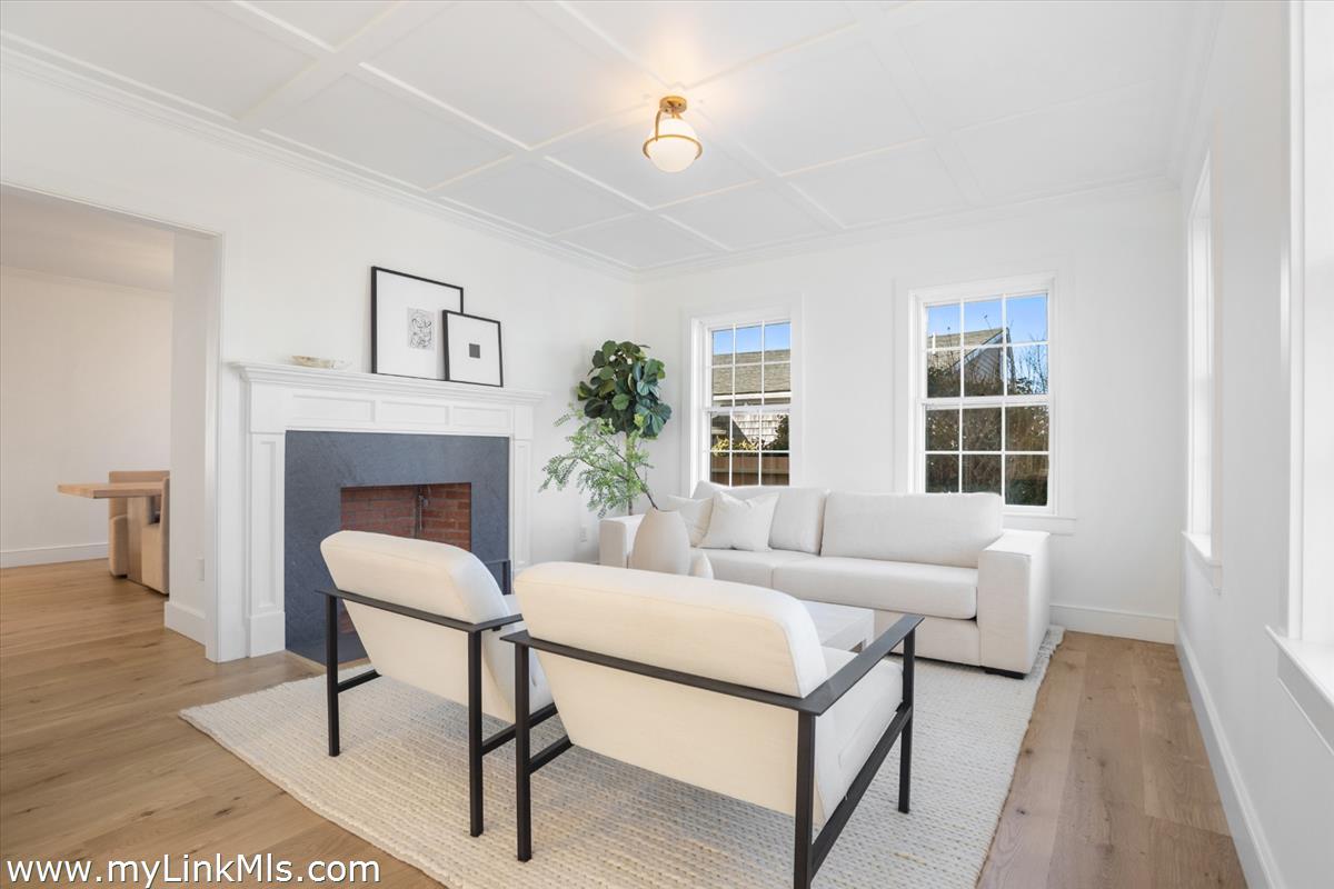 22 Vestal Street Nantucket, MA 02554 - Photo 12 of 43 a living room with furniture and a fireplace