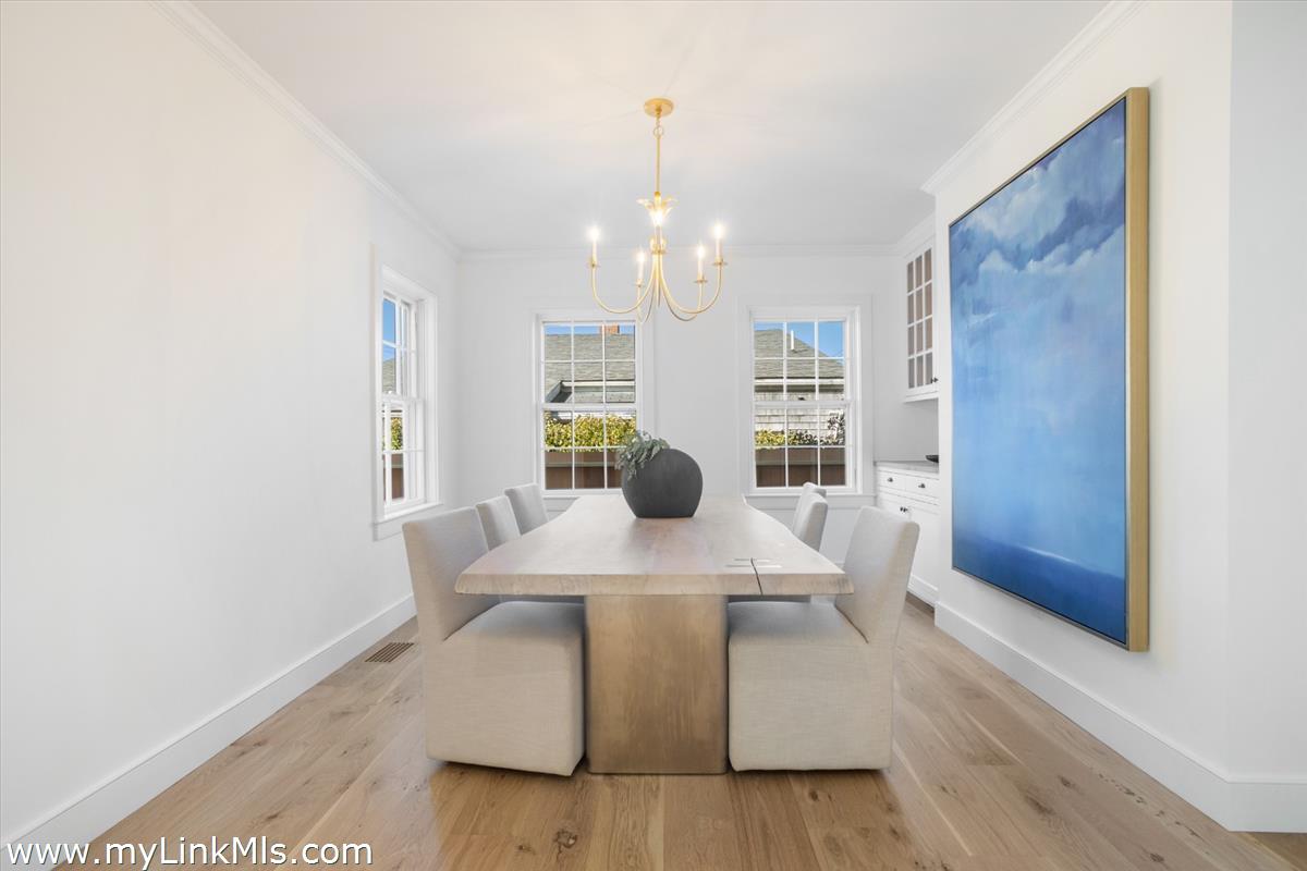 22 Vestal Street Nantucket, MA 02554 - Photo 13 of 43 a dining room with table and chairs