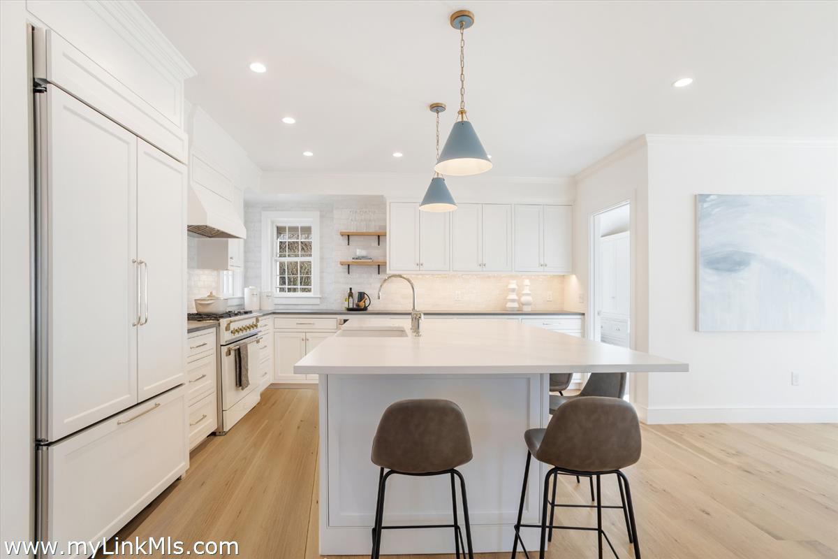 22 Vestal Street Nantucket, MA 02554 - Photo 16 of 43 a kitchen with kitchen island granite countertop a counter space a sink appliances and cabinets