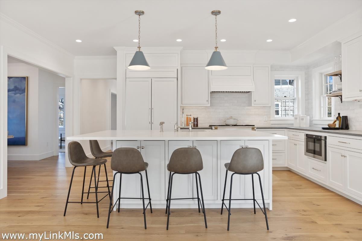 22 Vestal Street Nantucket, MA 02554 - Photo 17 of 43 a kitchen with granite countertop a counter top space appliances and cabinets