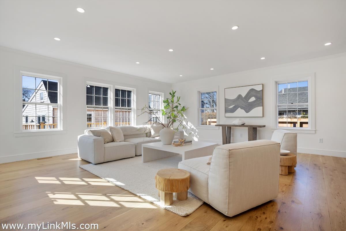 22 Vestal Street Nantucket, MA 02554 - Photo 18 of 43 a living room with fireplace furniture and a wooden floor