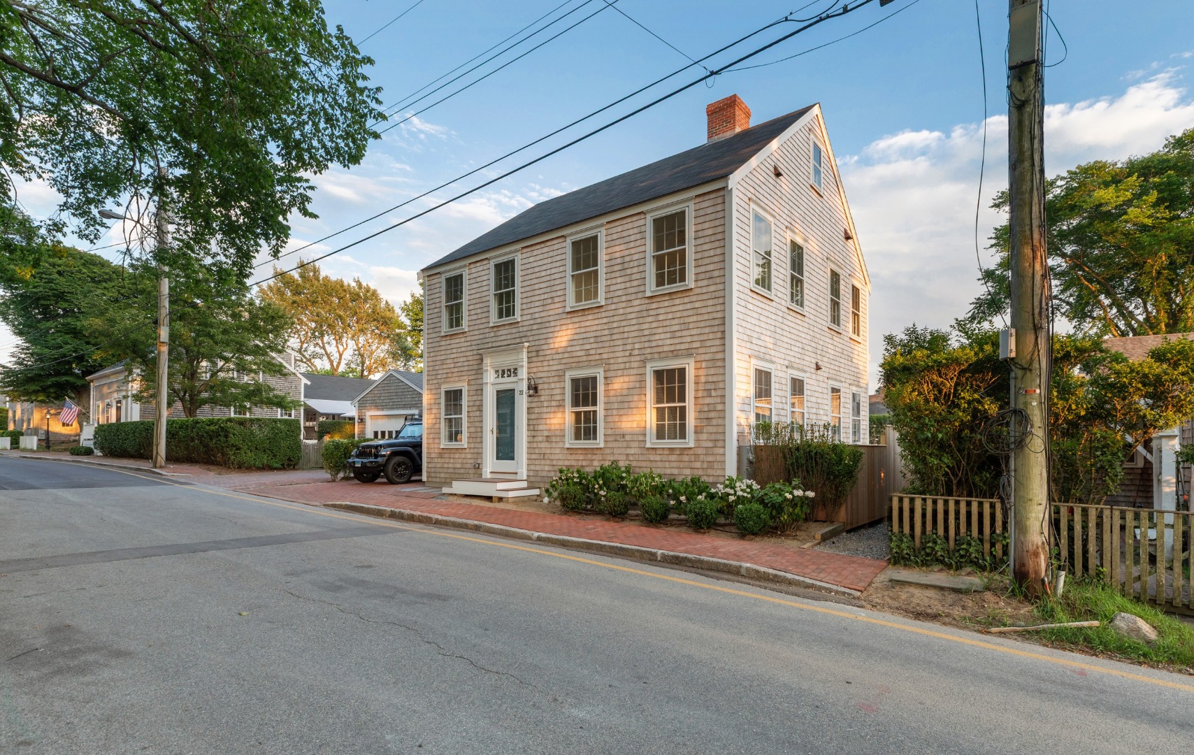 22 Vestal Street Nantucket, MA 02554 - Photo 2 of 43 a view of a house with a small yard and plants