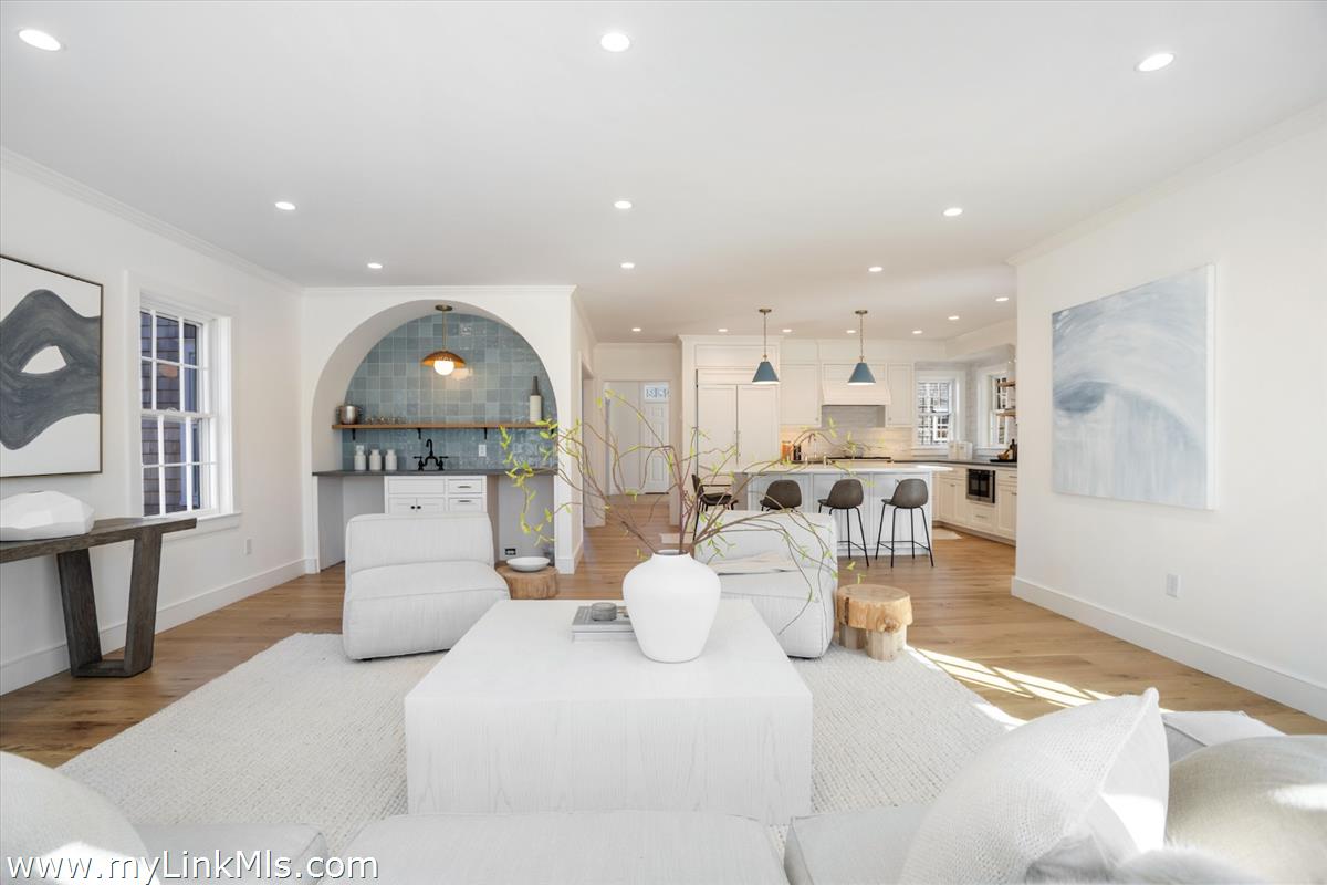 22 Vestal Street Nantucket, MA 02554 - Photo 21 of 43 a living room with furniture a wooden floor and kitchen view