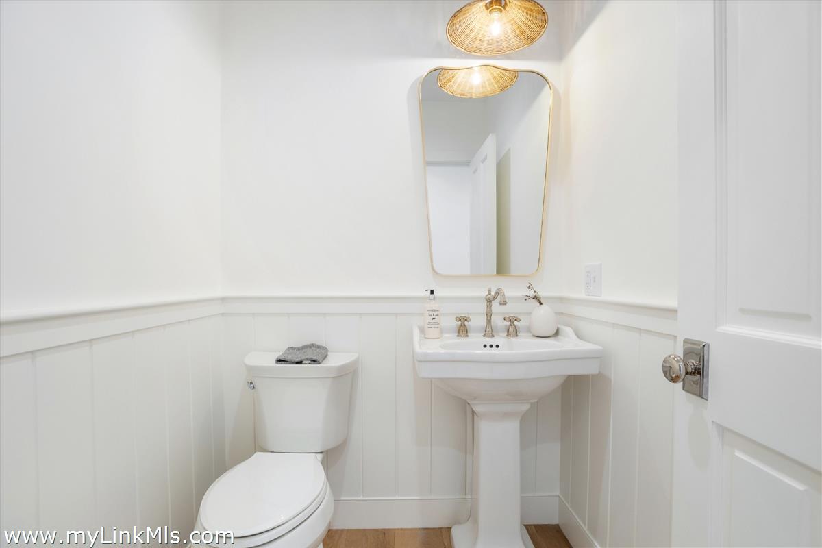 22 Vestal Street Nantucket, MA 02554 - Photo 24 of 43 a bathroom with a sink mirror and toilet