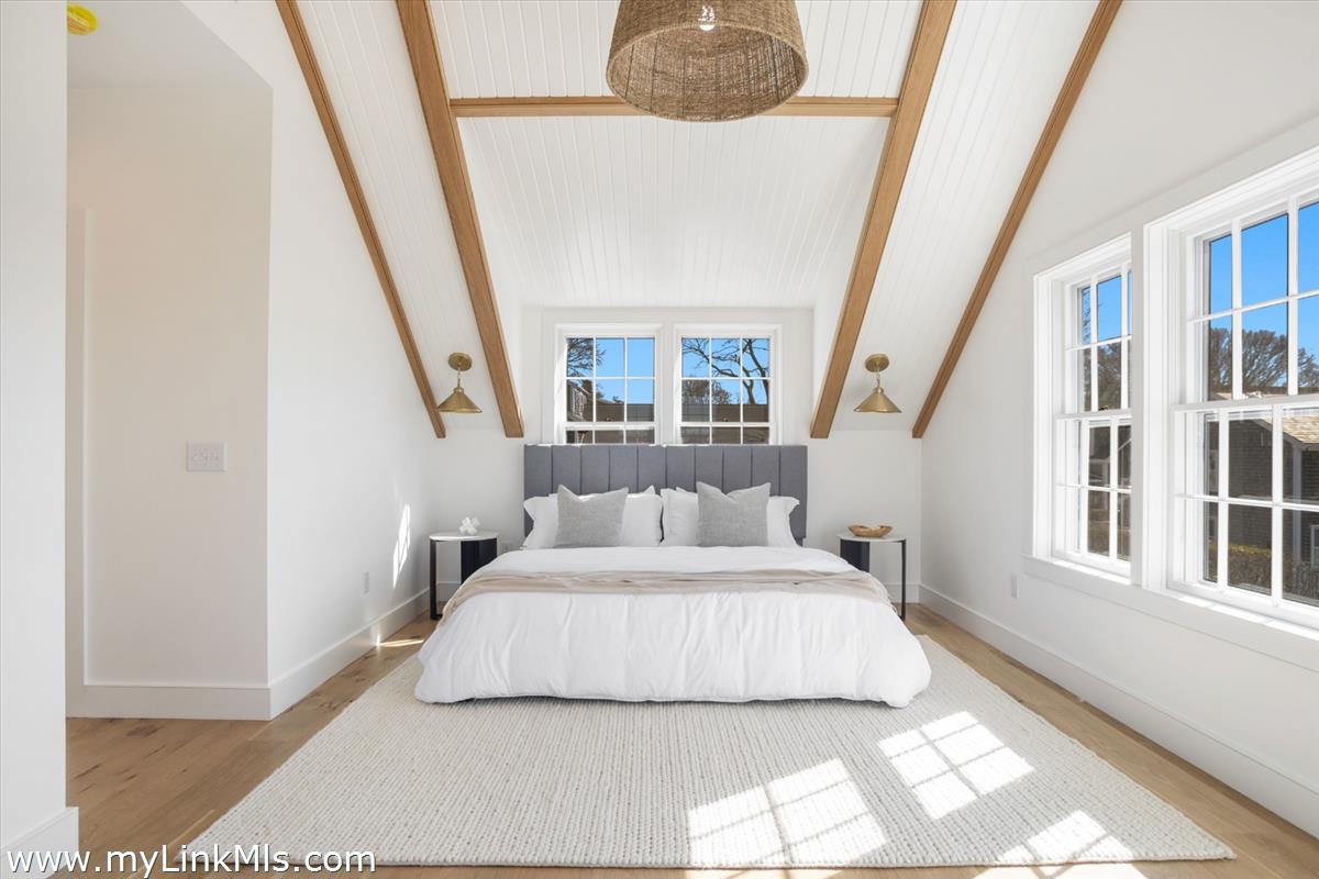 22 Vestal Street Nantucket, MA 02554 - Photo 25 of 43 a bedroom with a bed and a large window