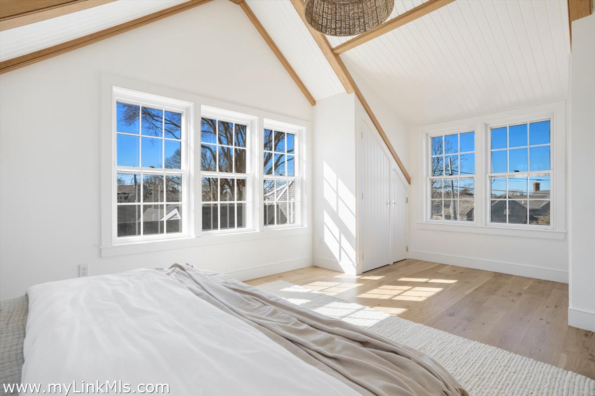 22 Vestal Street Nantucket, MA 02554 - Photo 26 of 43 a bedroom with a bed and a large window