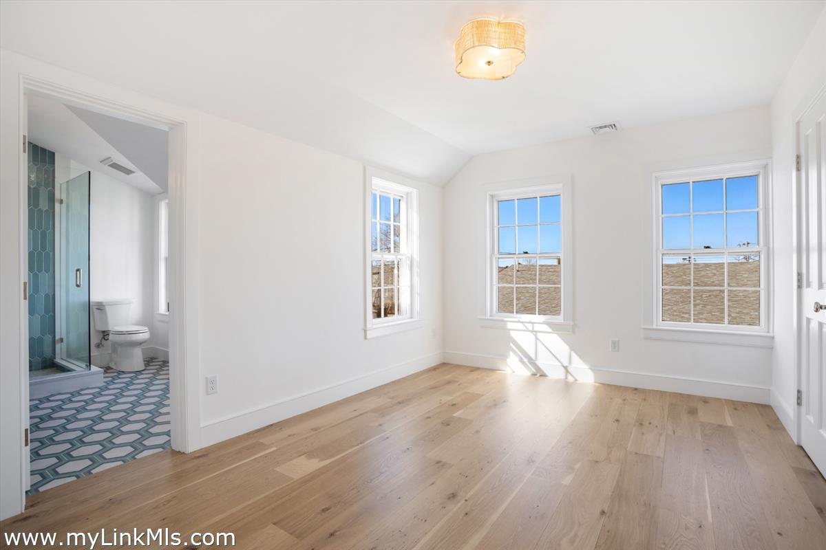 22 Vestal Street Nantucket, MA 02554 - Photo 30 of 43 a view of livingroom with hardwood floor and a window