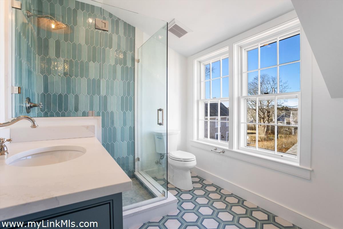 22 Vestal Street Nantucket, MA 02554 - Photo 32 of 43 a bathroom with a sink toilet and shower