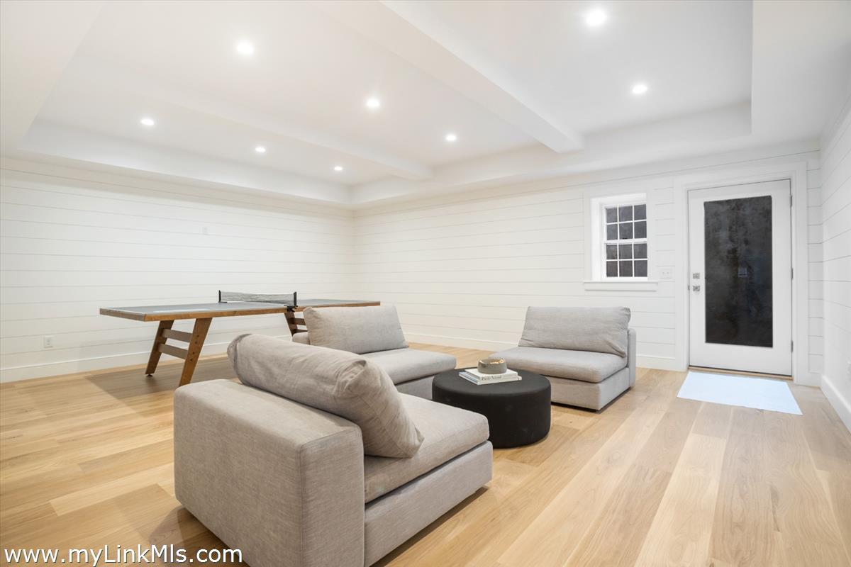 22 Vestal Street Nantucket, MA 02554 - Photo 38 of 43 a living room with furniture and a wooden floor