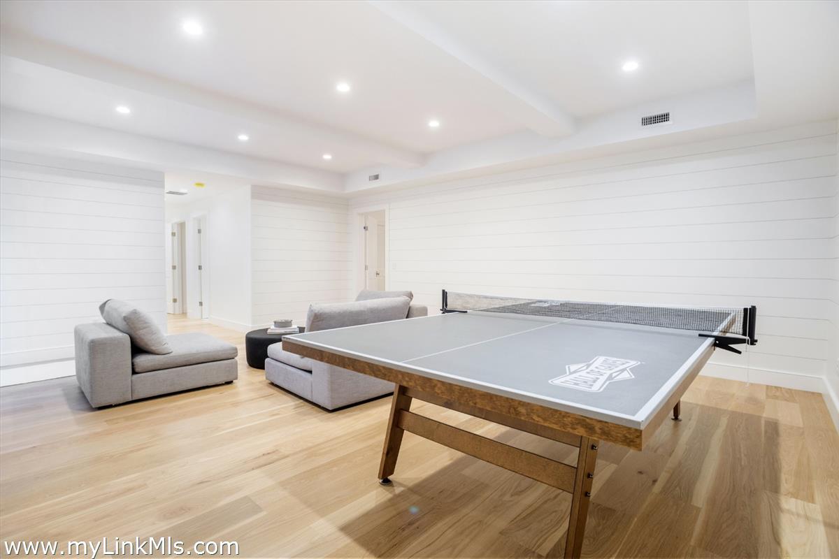 22 Vestal Street Nantucket, MA 02554 - Photo 40 of 43 a living room with hard wood flooring and furniture